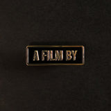 A Film by Credit Enamel Pin