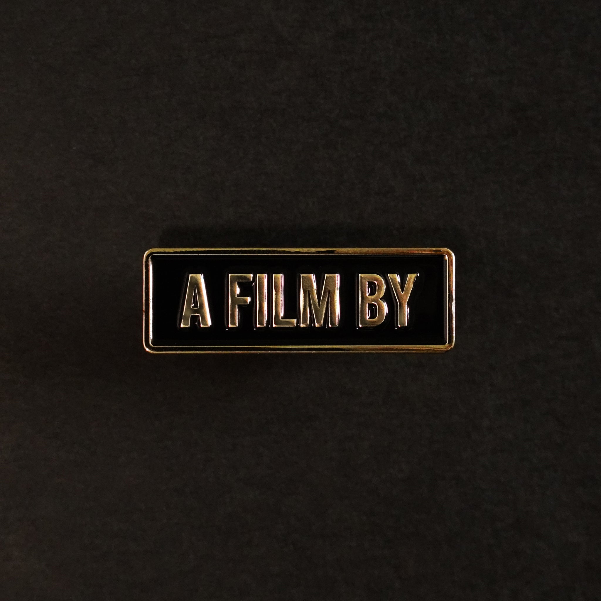 A Film by Credit Enamel Pin
