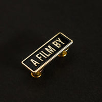 A Film by Credit Enamel Pin