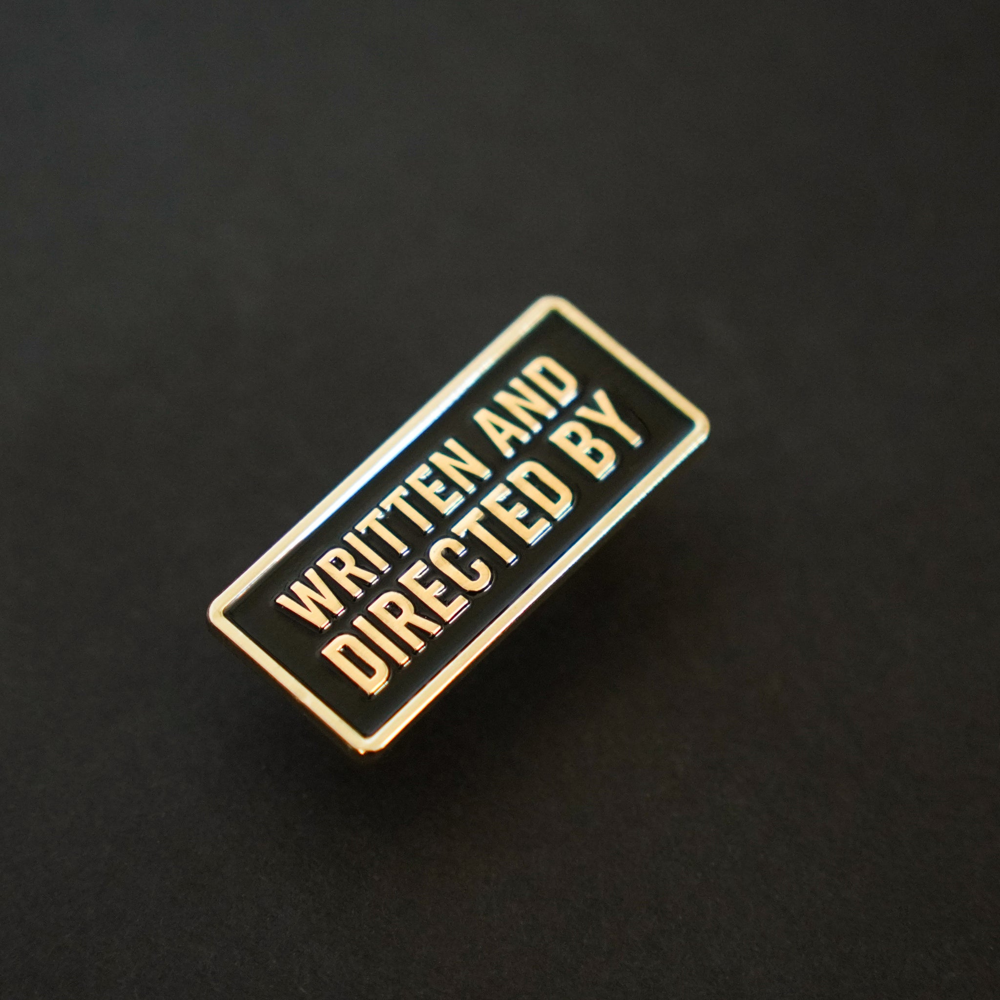Written and Directed by Credit Enamel Pin